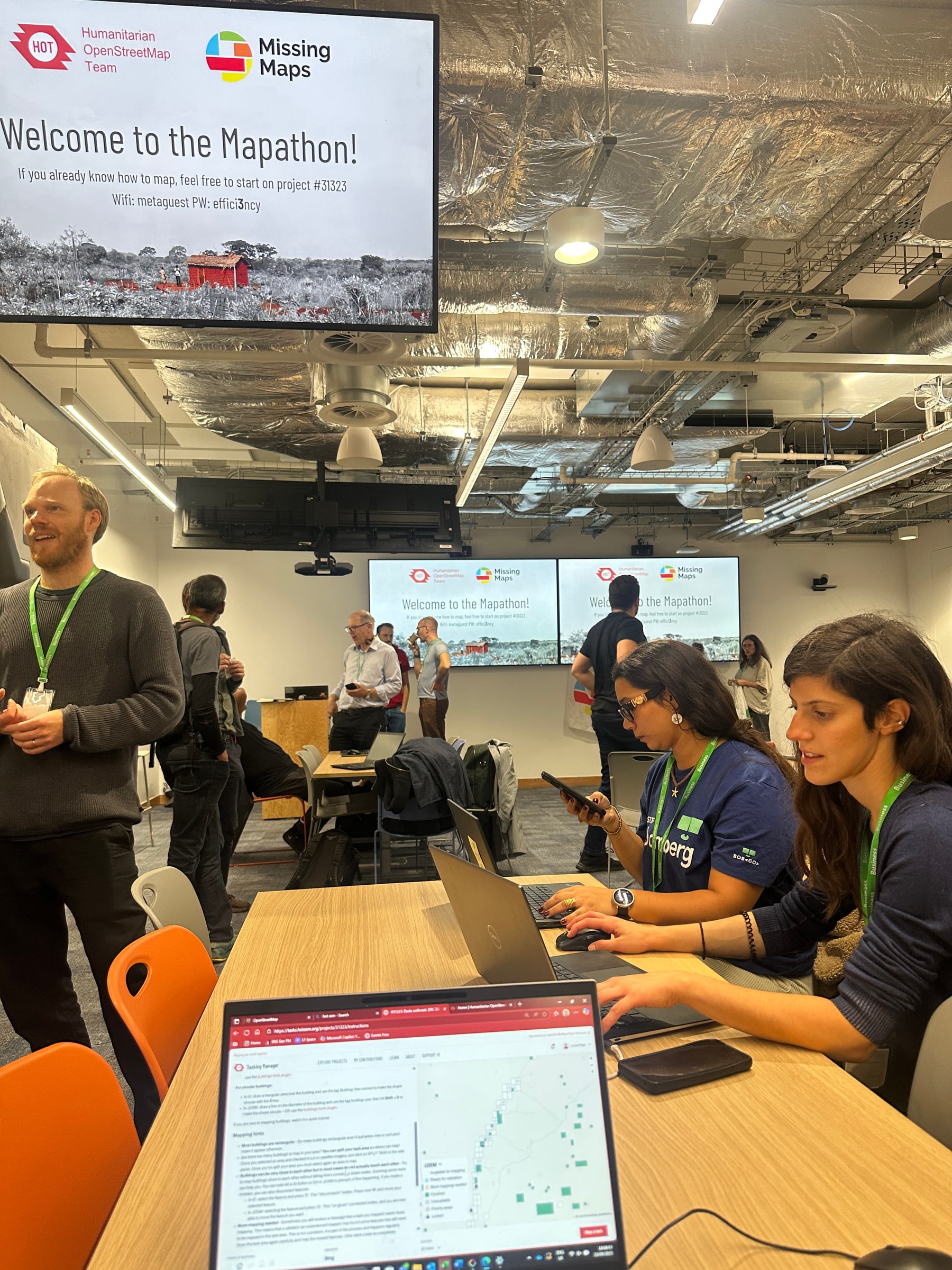 People mapping at laptops during a mapathon