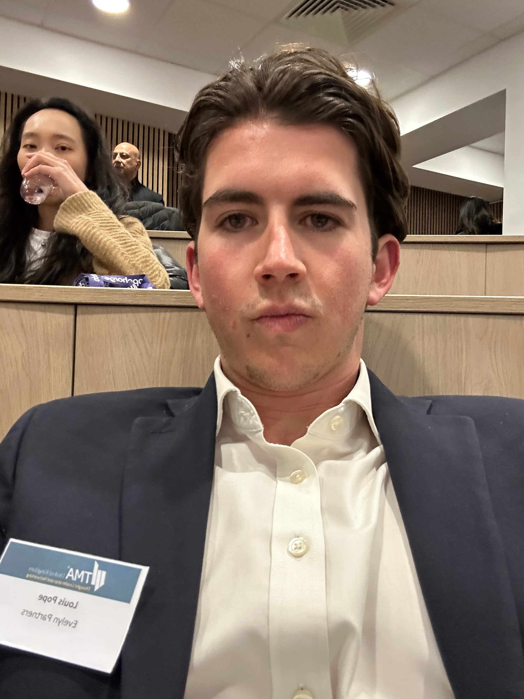 Louis at a restructuring conference wearing an Evelyn Partners name badge